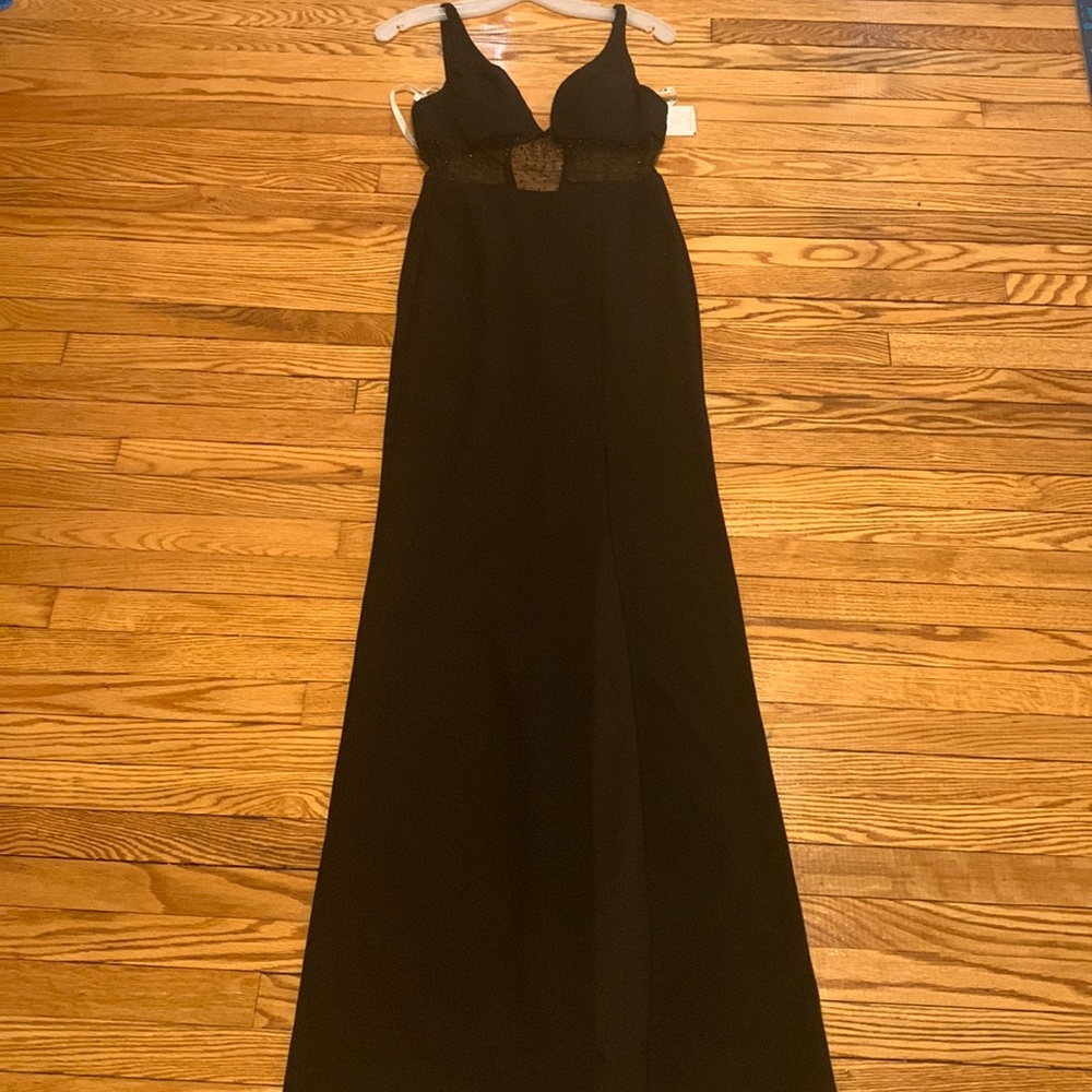Black formal dress. Mesh middle. Slit down left leg. Size 0